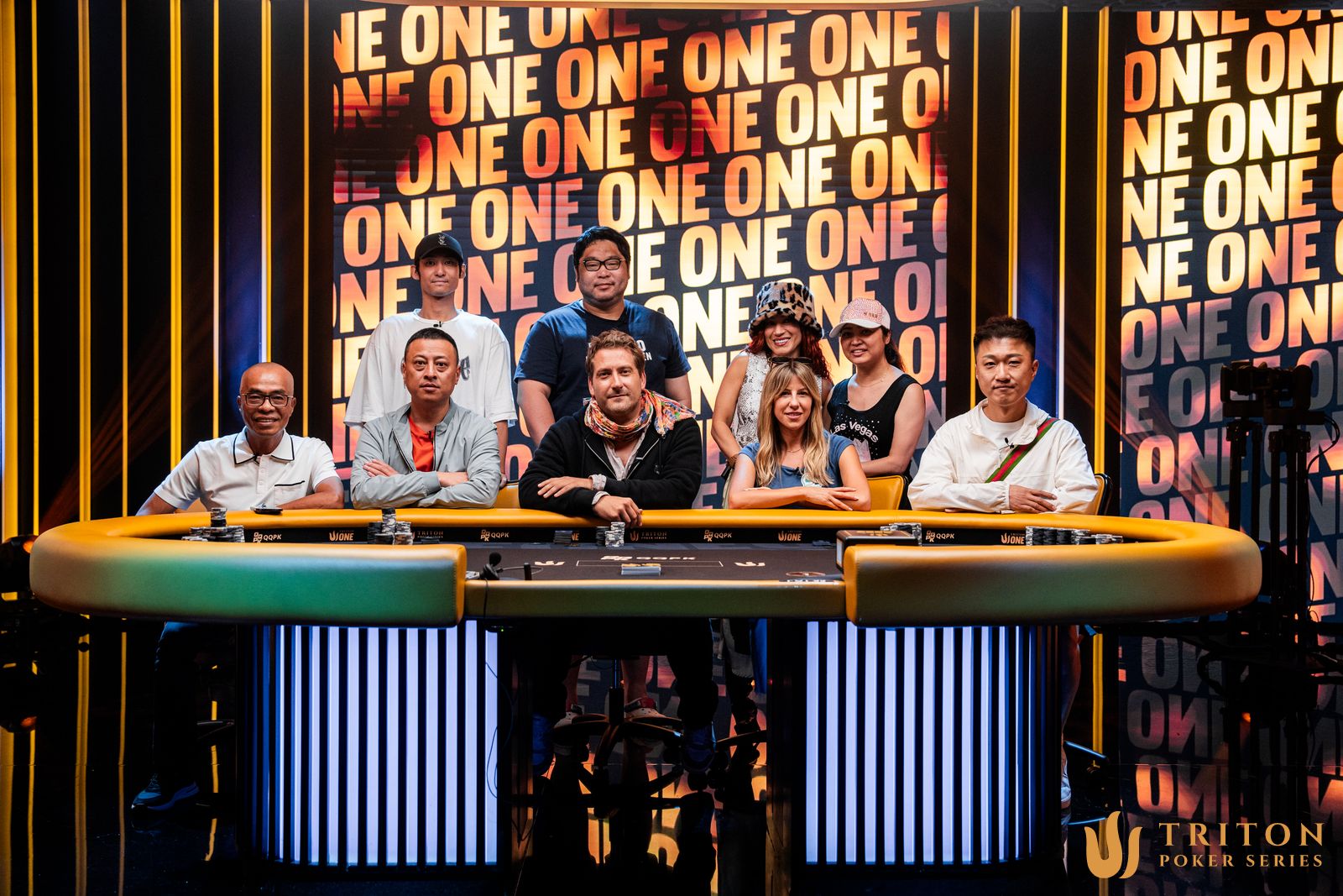 Event 5 final table players (clockwise from back left): Kento Nasu, Chenxiang Miao, Ebony Kenney, Thi Xoa Nguyen, Xiaqing Ji, Kristen Foxen, Hugues Girard, Manh Tien Duong.