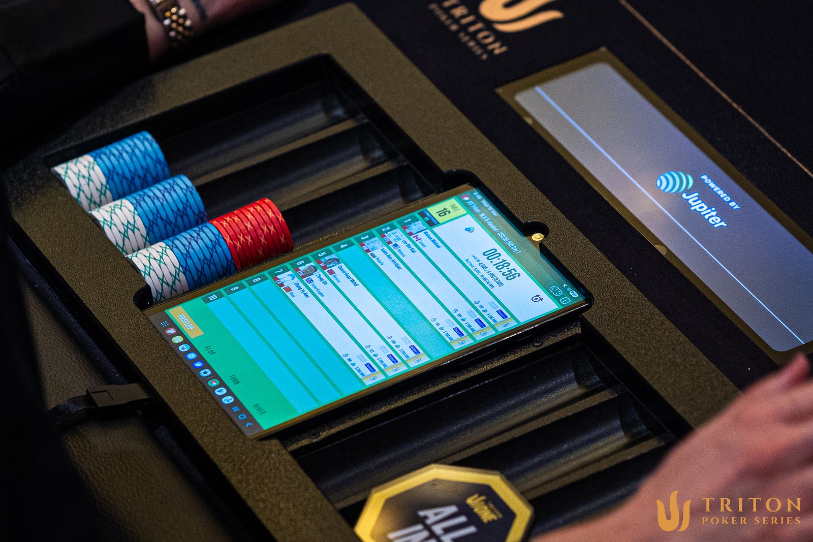 The dealer controls the Triton Tempo interface at the table