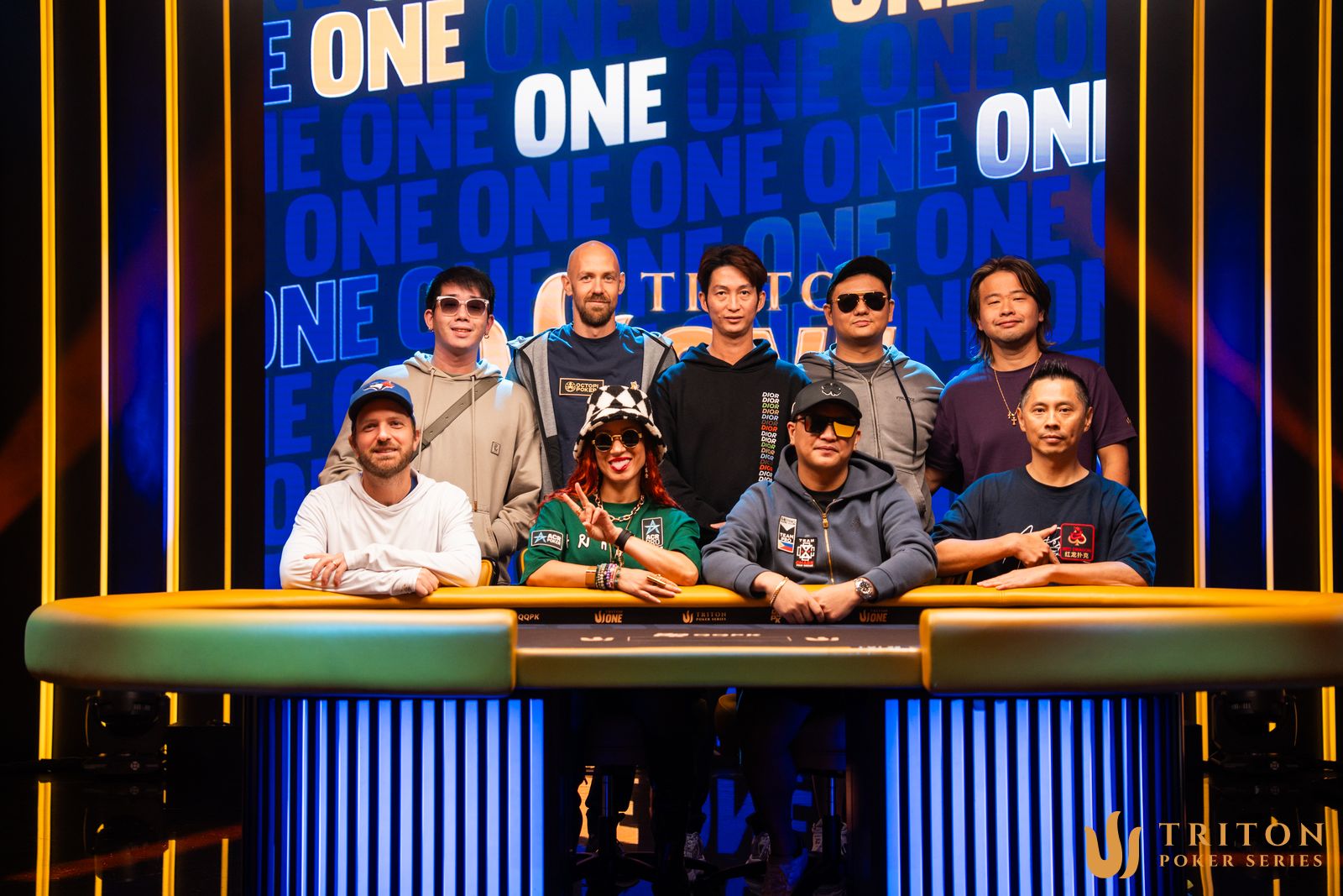 Triton ONE High Roller final table players (clockwise from back left): Jun Hao Wu, Stephen Chidwick, Yeu Wei Hsiang, Teng Kah Yew, Yu Xiangyu, Luo Xixiang, Vamerdino Magsakay, Ebony Kenney, Mike Watson.